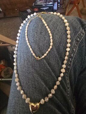 Freshwater pearls puffy gold tone accents with hearts.